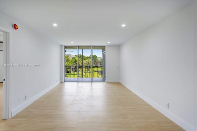 3361 NW 47th Ter Unit 329, Lauderdale Lakes, FL 33319 - unfurnished room featuring floor to ceiling windows, baseboards, and recessed lighting