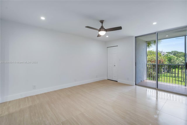 3361 NW 47th Ter Unit 329, Lauderdale Lakes, FL 33319 - empty room featuring floor to ceiling windows, ceiling fan, baseboards, and recessed lighting