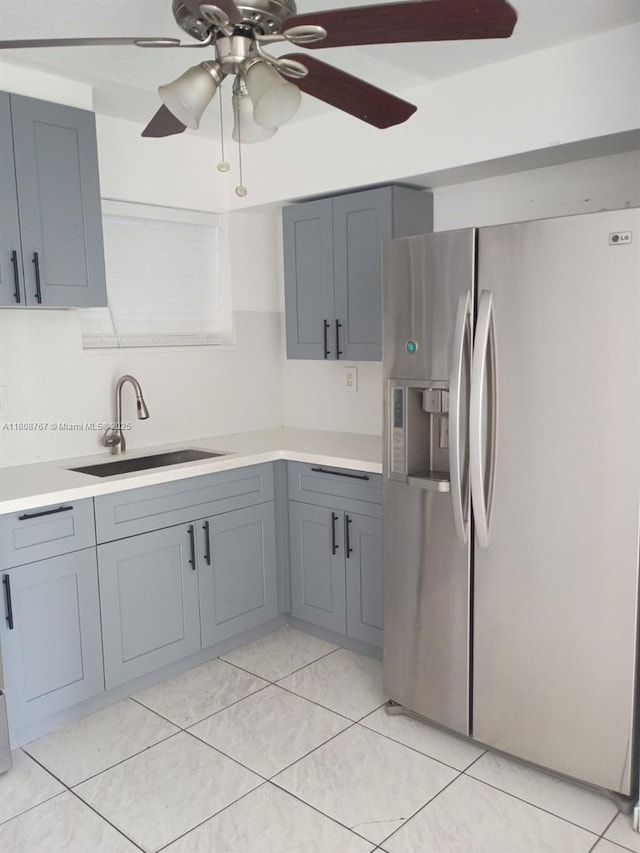 1800 SW 25th St Unit 2305, Miami, FL 33133 - kitchen with stainless steel refrigerator with ice dispenser, a sink, ceiling fan, light countertops, and gray cabinets