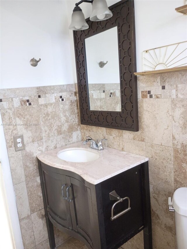 1800 SW 25th St Unit 2305, Miami, FL 33133 - bathroom with tile walls, vanity, and toilet