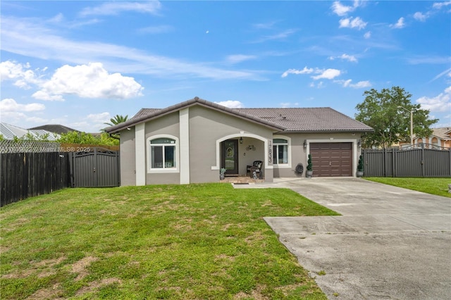17833 SW 149th Pl, Miami, FL 33187 - view of front of home featuring a gate, concrete driveway, an attached garage, stucco siding, and a tile roof