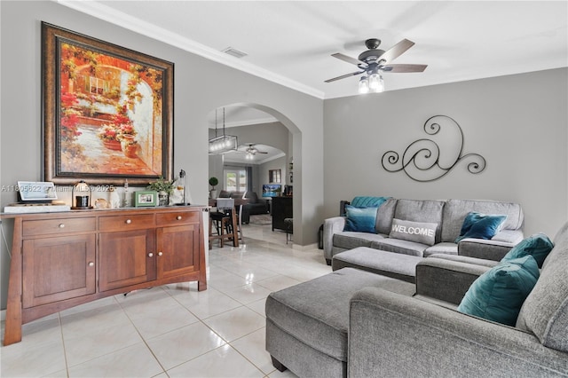 17833 SW 149th Pl, Miami, FL 33187 - living room with a ceiling fan, crown molding, arched walkways, and light tile patterned floors