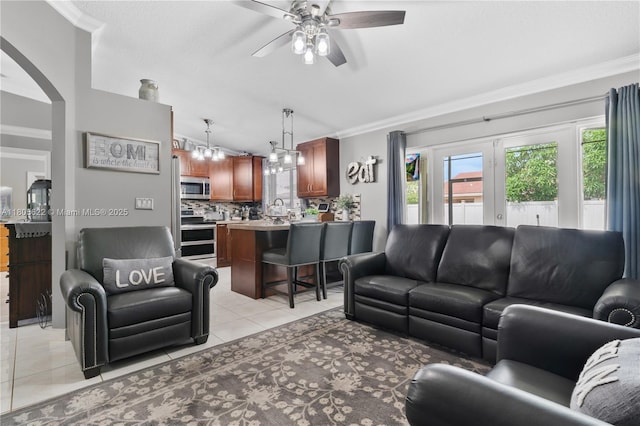 17833 SW 149th Pl, Miami, FL 33187 - living area with a ceiling fan, crown molding, arched walkways, and light tile patterned floors
