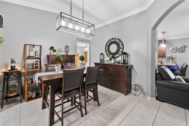 17833 SW 149th Pl, Miami, FL 33187 - dining area featuring ornamental molding, arched walkways, and light tile patterned floors