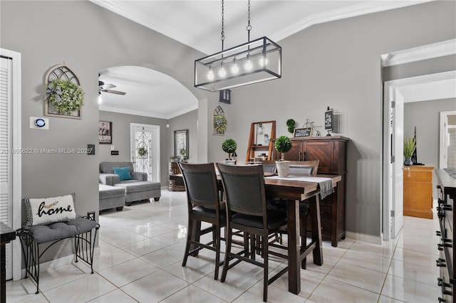 17833 SW 149th Pl, Miami, FL 33187 - dining space with vaulted ceiling, ornamental molding, arched walkways, ceiling fan, and light tile patterned floors