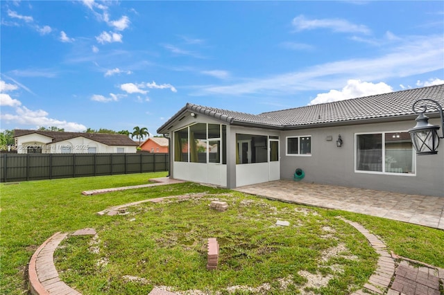 17833 SW 149th Pl, Miami, FL 33187 - back of house featuring a sunroom, a tile roof, a patio, and stucco siding