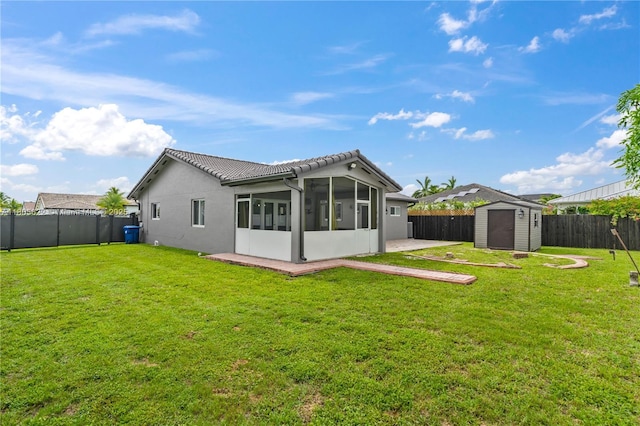 17833 SW 149th Pl, Miami, FL 33187 - rear view of property featuring a sunroom, a storage shed, a fenced backyard, a tile roof, and stucco siding