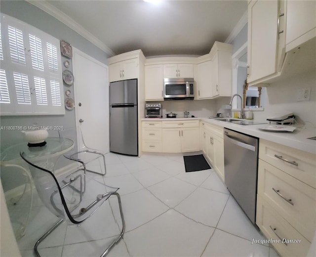 3600 NE 170th St Unit 404, North Miami Beach, FL 33160 - kitchen with appliances with stainless steel finishes, ornamental molding, light countertops, white cabinets, and a sink