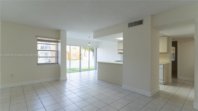 9300 W Flagler St Unit 112D, Miami, FL 33174 - unfurnished room with light tile patterned floors, baseboards, and a textured ceiling