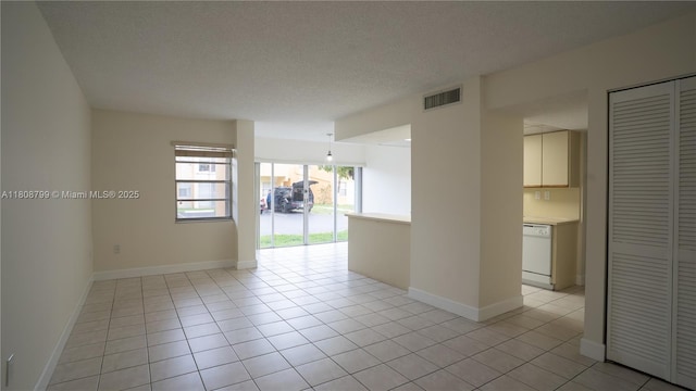 9300 W Flagler St Unit 112D, Miami, FL 33174 - unfurnished room featuring a textured ceiling, baseboards, and light tile patterned flooring
