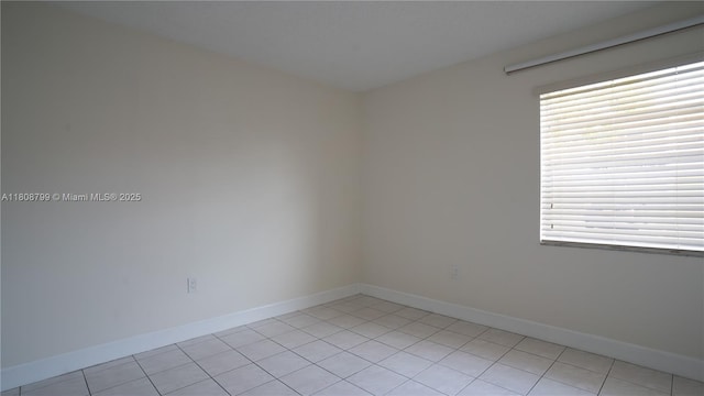 9300 W Flagler St Unit 112D, Miami, FL 33174 - unfurnished room with light tile patterned floors, plenty of natural light, and baseboards
