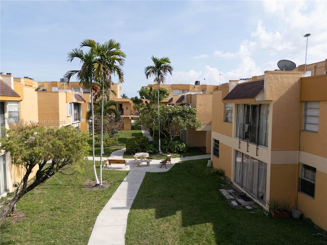 9300 W Flagler St Unit 112D, Miami, FL 33174 - view of home's community featuring a residential view and a lawn
