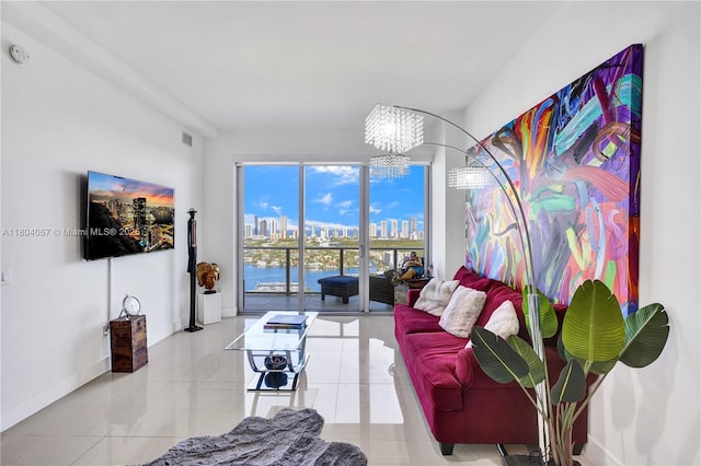 16385 Biscayne Blvd Unit 3217, North Miami Beach, FL 33160 - living room featuring a chandelier, tile patterned flooring, and baseboards