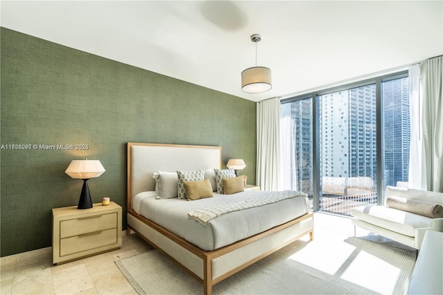 68 SE 6th St Unit 1403, Miami, FL 33131 - bedroom featuring expansive windows and access to exterior