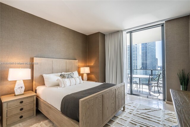 68 SE 6th St Unit 1403, Miami, FL 33131 - bedroom with a wall of windows and access to exterior