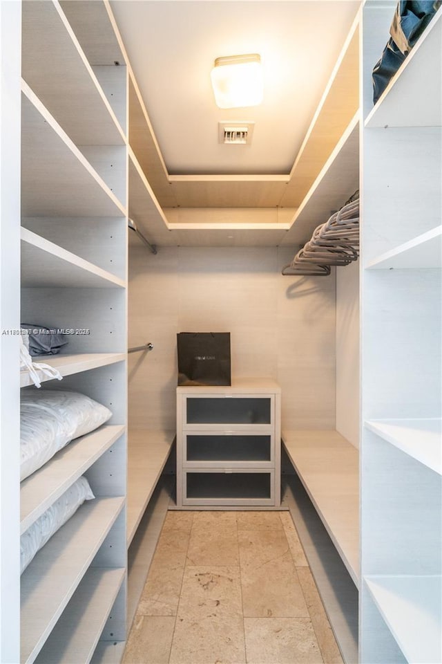 68 SE 6th St Unit 1403, Miami, FL 33131 - walk in closet with a tray ceiling