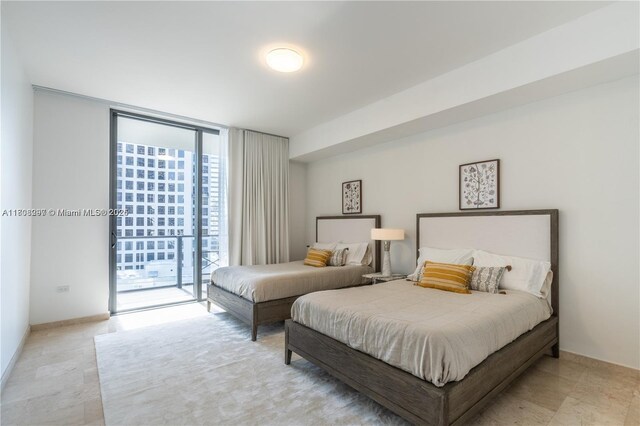68 SE 6th St Unit 1403, Miami, FL 33131 - bedroom with access to outside and a wall of windows