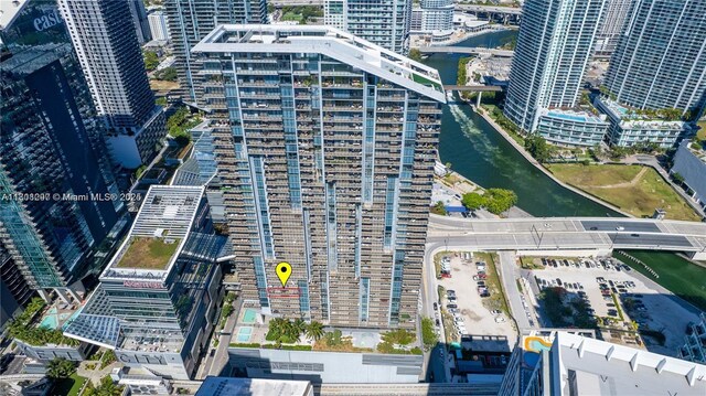 68 SE 6th St Unit 1403, Miami, FL 33131 - aerial view of property and surrounding area featuring a large body of water, nearby urban area, and a notable bridge