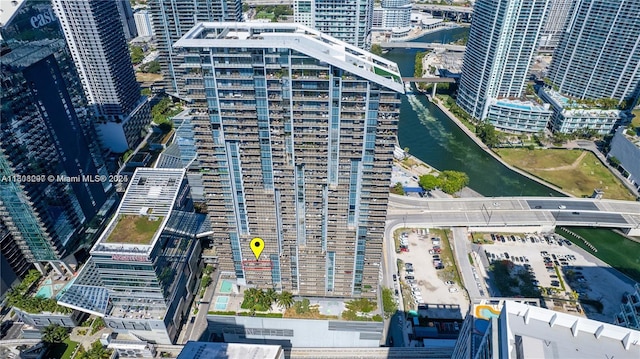 68 SE 6th St Unit 1403, Miami, FL 33131 - aerial overview of property's location featuring a large body of water, a notable bridge, and nearby urban area