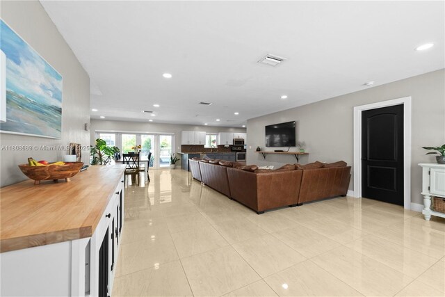 19525 SW 272nd St, Homestead, FL 33031 - living area with light tile patterned flooring and recessed lighting