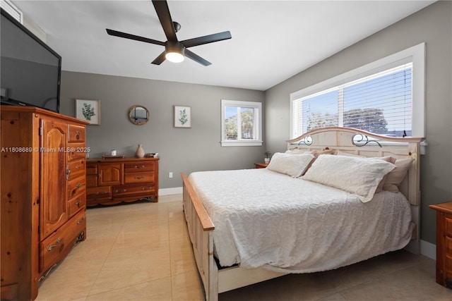 19525 SW 272nd St, Homestead, FL 33031 - bedroom with light tile patterned floors, baseboards, and ceiling fan