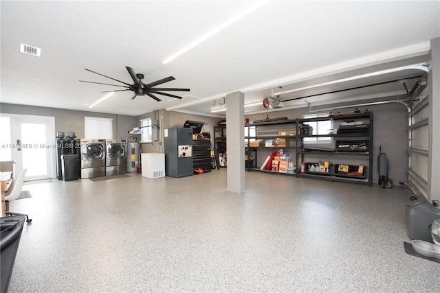 19525 SW 272nd St, Homestead, FL 33031 - garage with washing machine and clothes dryer, a ceiling fan, and electric water heater