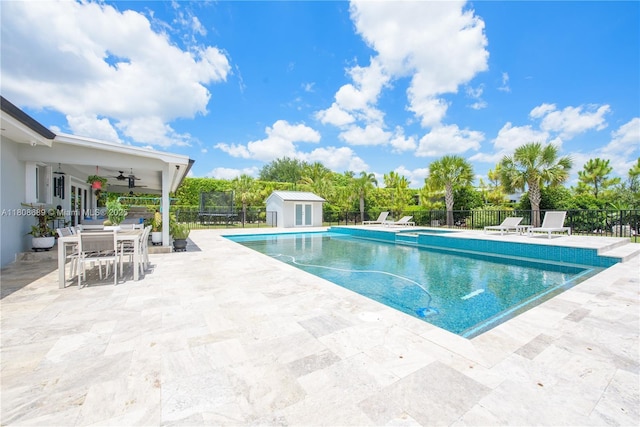 19525 SW 272nd St, Homestead, FL 33031 - view of swimming pool featuring a patio, a ceiling fan, and an outdoor structure