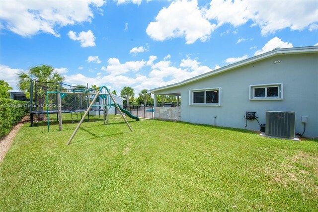 19525 SW 272nd St, Homestead, FL 33031 - view of yard featuring cooling unit and a trampoline