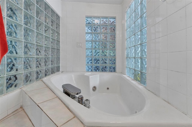 2442 Fillmore St, Hollywood, FL 33020 - bathroom with a whirlpool tub and tile walls