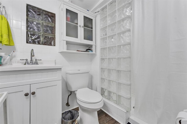 2442 Fillmore St, Hollywood, FL 33020 - bathroom featuring tile walls, vanity, a shower with curtain, and wood finished floors