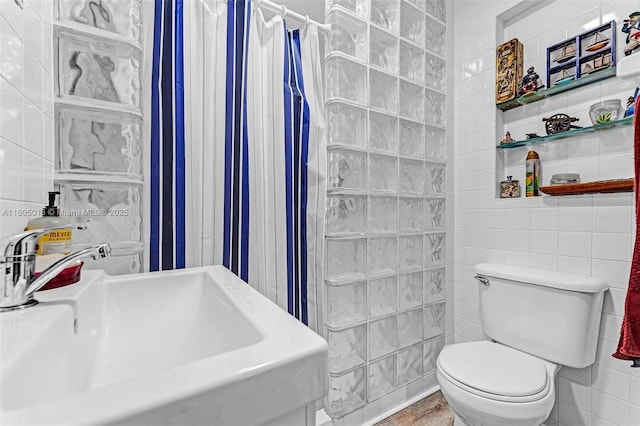 2442 Fillmore St, Hollywood, FL 33020 - bathroom featuring tile walls and a shower with shower curtain