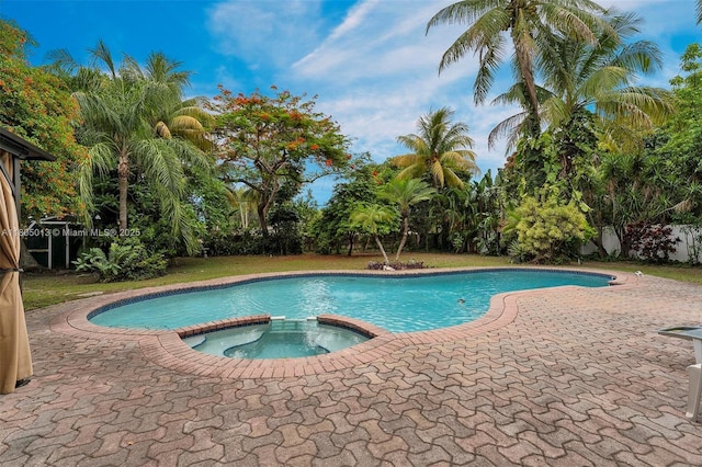 2442 Fillmore St, Hollywood, FL 33020 - view of pool with a pool with connected hot tub and a patio