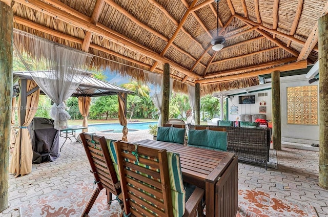 2442 Fillmore St, Hollywood, FL 33020 - view of patio featuring a gazebo, an outdoor pool, and outdoor lounge area