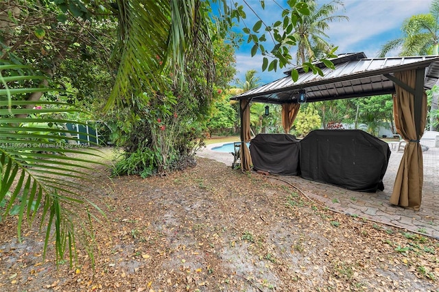2442 Fillmore St, Hollywood, FL 33020 - view of yard with a gazebo and an outdoor pool