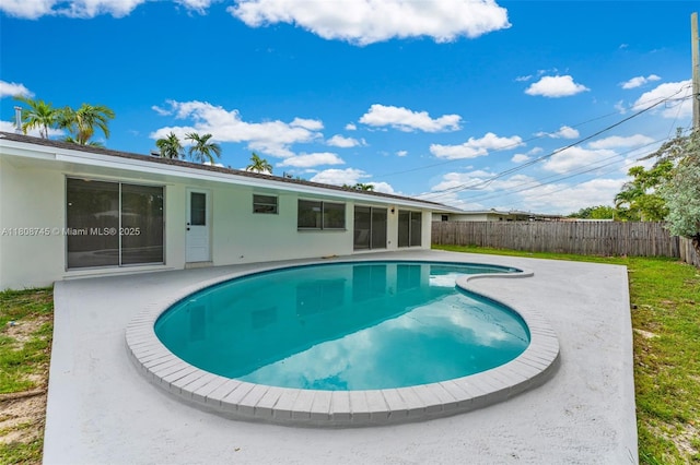 17761 SW 113th Ct, Miami, FL 33157 - view of swimming pool with a fenced backyard, a patio area, and a sunroom