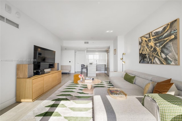 121 NE 34th St Unit 2412, Miami, FL 33137 - living room with light wood-style flooring