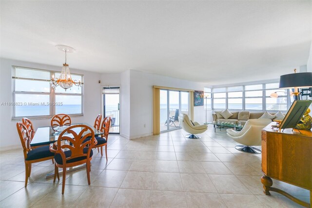 1950 S Ocean Dr Unit 18Q, Hallandale Beach, FL 33009 - dining area with a chandelier, light tile patterned floors, and baseboards