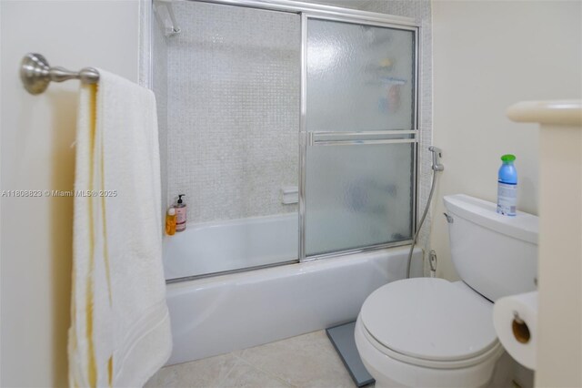 1950 S Ocean Dr Unit 18Q, Hallandale Beach, FL 33009 - bathroom with toilet, combined bath / shower with glass door, and tile patterned floors