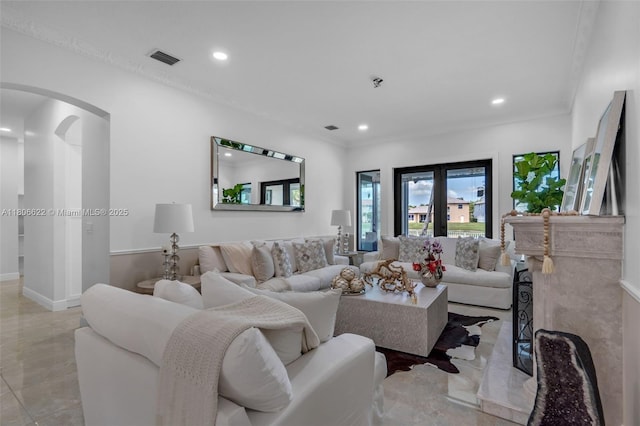3560 SW 145th Ave, Miramar, FL 33027 - living room featuring arched walkways, recessed lighting, ornamental molding, and baseboards