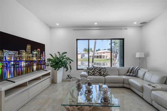 3560 SW 145th Ave, Miramar, FL 33027 - living room featuring recessed lighting, a textured ceiling, and marble finish floors