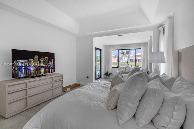 3560 SW 145th Ave, Miramar, FL 33027 - bedroom with a tray ceiling, baseboards, and access to exterior