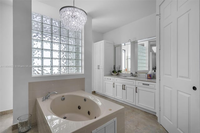 3560 SW 145th Ave, Miramar, FL 33027 - bathroom with a whirlpool tub, vanity, and a chandelier