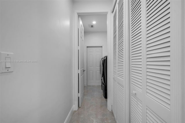 3560 SW 145th Ave, Miramar, FL 33027 - hallway featuring washing machine and clothes dryer and baseboards