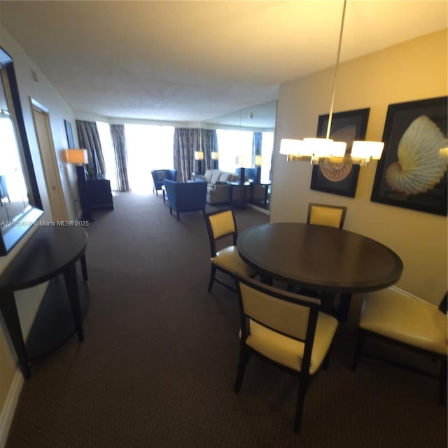 17375 Collins Ave Unit 1101, Sunny Isles Beach, FL 33160 - dining space featuring carpet and a chandelier