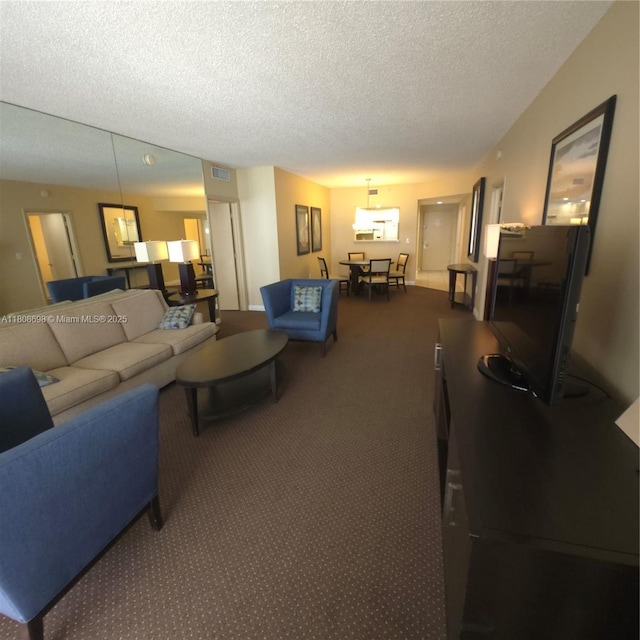 17375 Collins Ave Unit 1101, Sunny Isles Beach, FL 33160 - living area with carpet floors and a textured ceiling