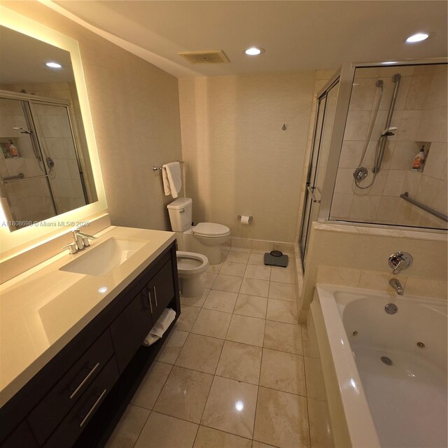 17375 Collins Ave Unit 1101, Sunny Isles Beach, FL 33160 - full bathroom with toilet, a shower stall, vanity, a jetted tub, and recessed lighting