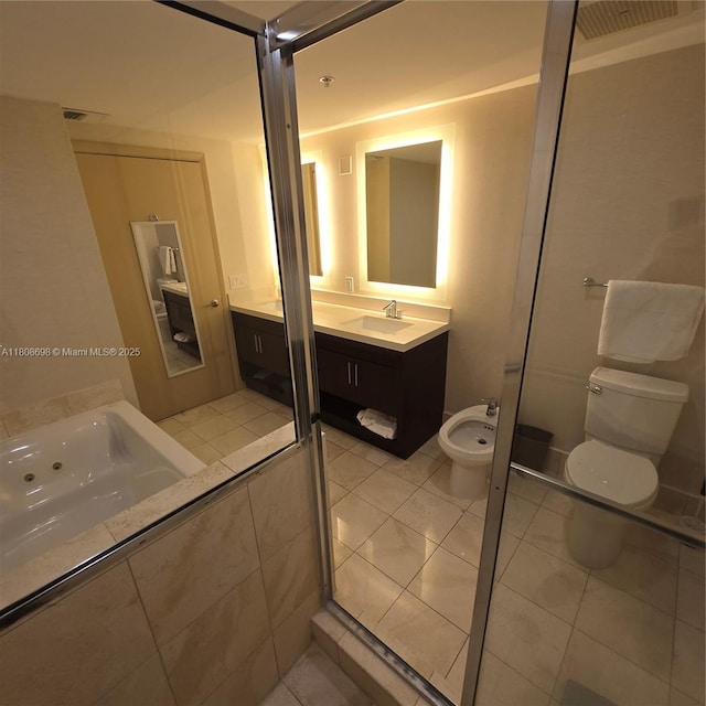 17375 Collins Ave Unit 1101, Sunny Isles Beach, FL 33160 - bathroom with toilet, a bidet, vanity, and tile patterned flooring