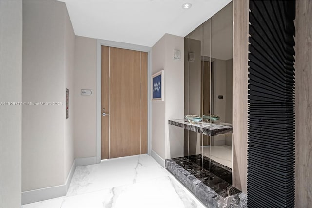 15701 Collins Ave Unit 705, Sunny Isles Beach, FL 33160 - corridor featuring marble tiled floors, baseboards, and recessed lighting