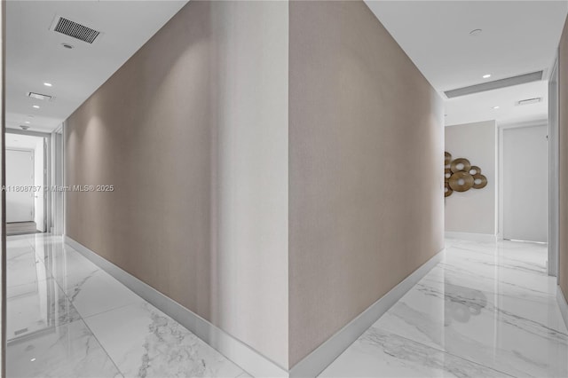 15701 Collins Ave Unit 705, Sunny Isles Beach, FL 33160 - corridor featuring light marble finish flooring, recessed lighting, and baseboards