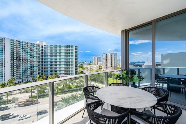 15701 Collins Ave Unit 705, Sunny Isles Beach, FL 33160 - balcony featuring a view of city and outdoor dining area